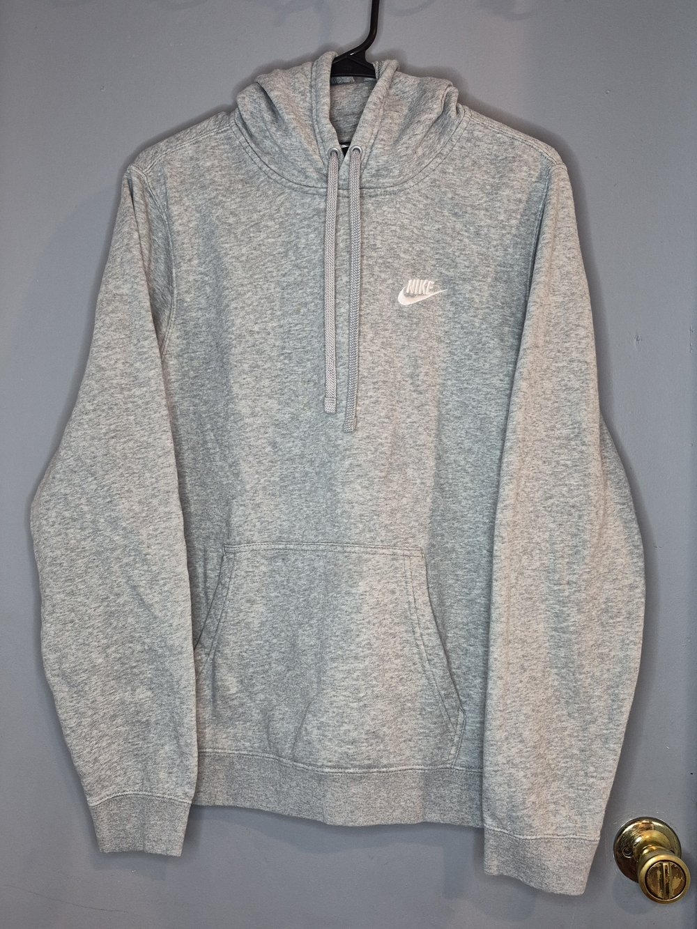 Nike Grey Pullover Hoodie with White Swoosh.